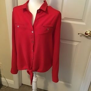 Alberto Makali red blouse with gold buttons.